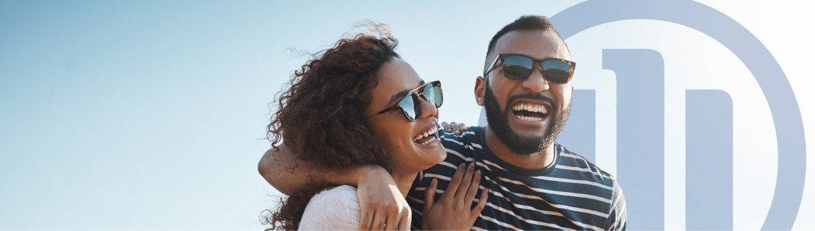 Couple laughing with sunglasses on