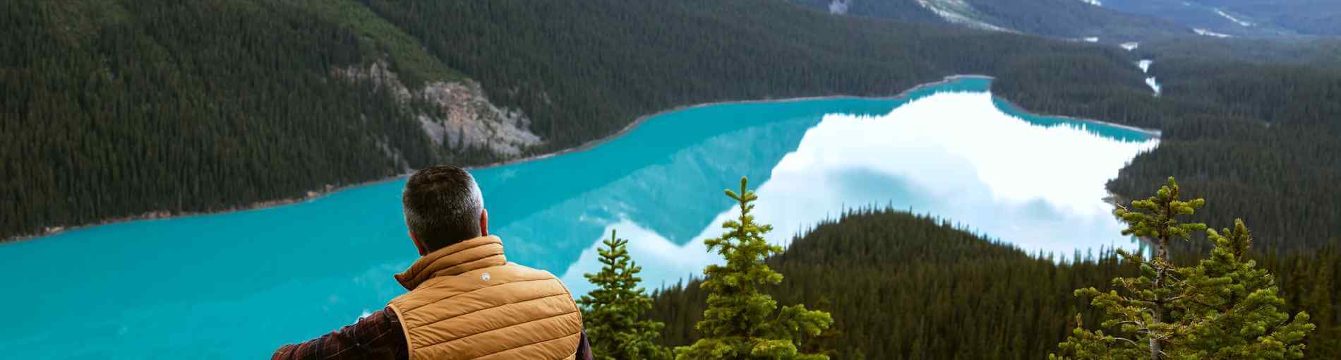 Man looking over Canadian lake